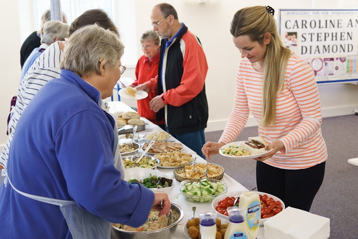 serving food to the community at Thursday Cafe